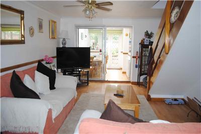 Full image of The living room and stairwell of one of the houses we first ruled-out.