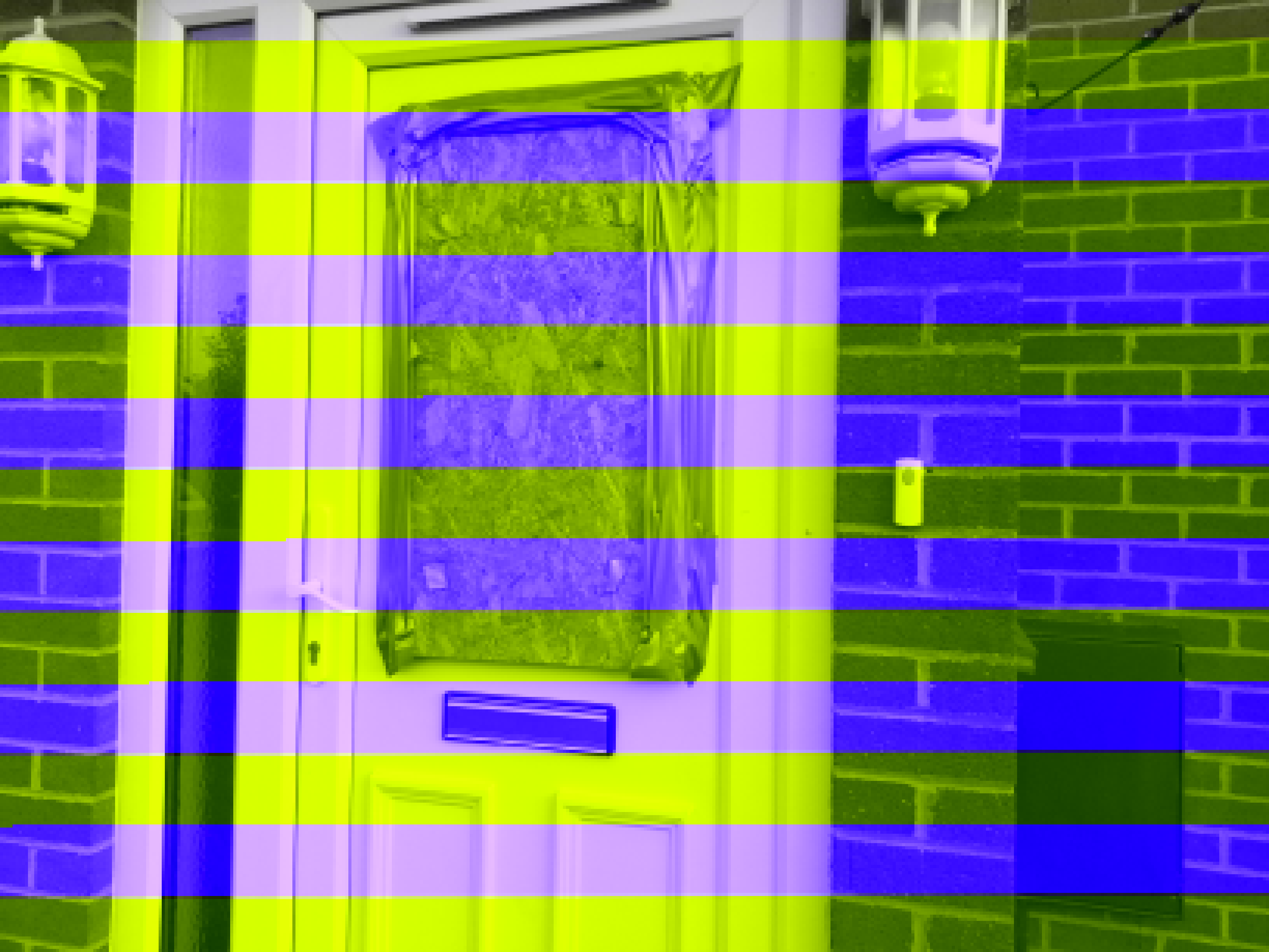 Full image of A front door with a hole, boarded up with plywood.