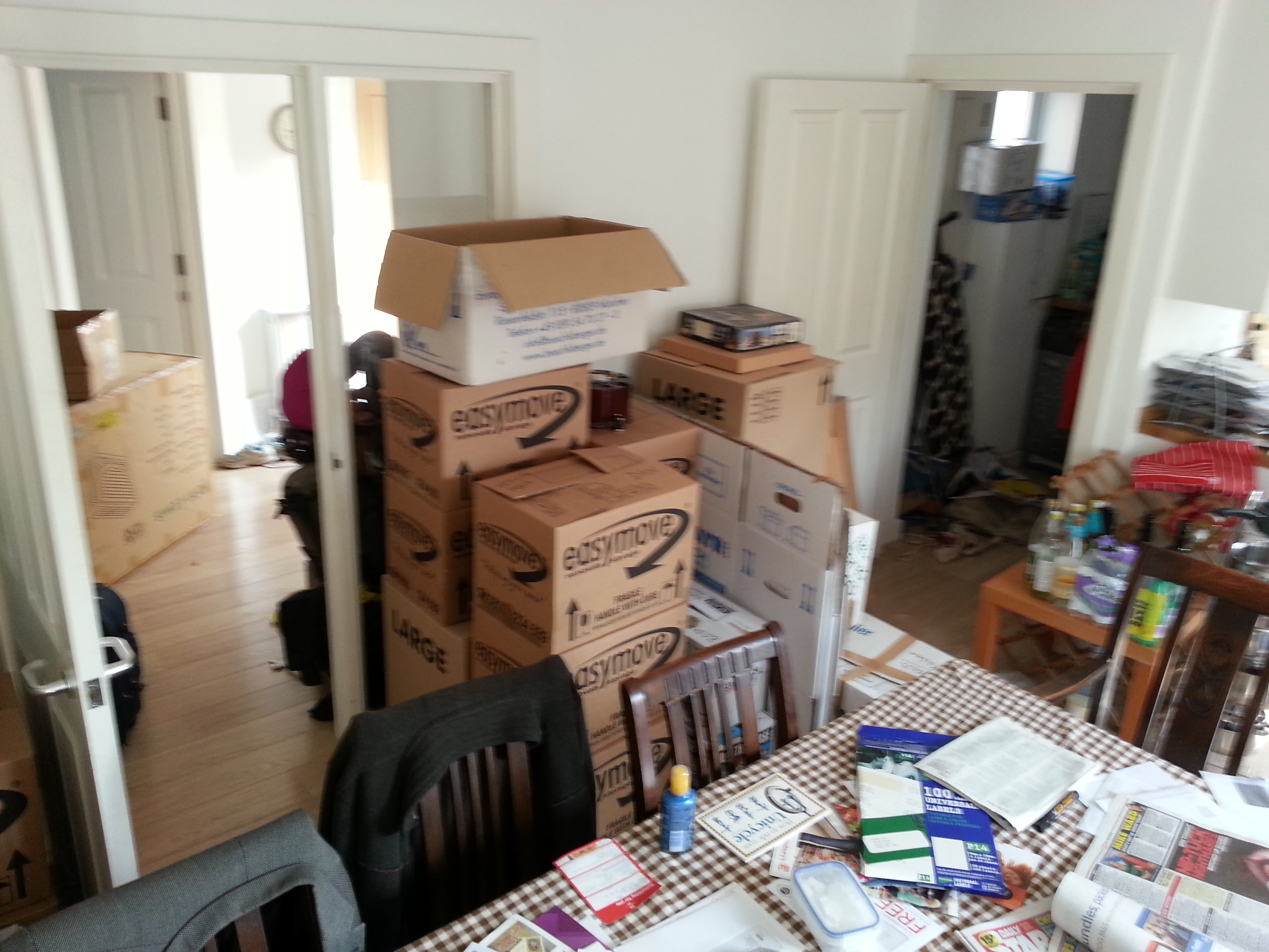 Full image of Piles of boxes - mostly full of board games! - at our old house.