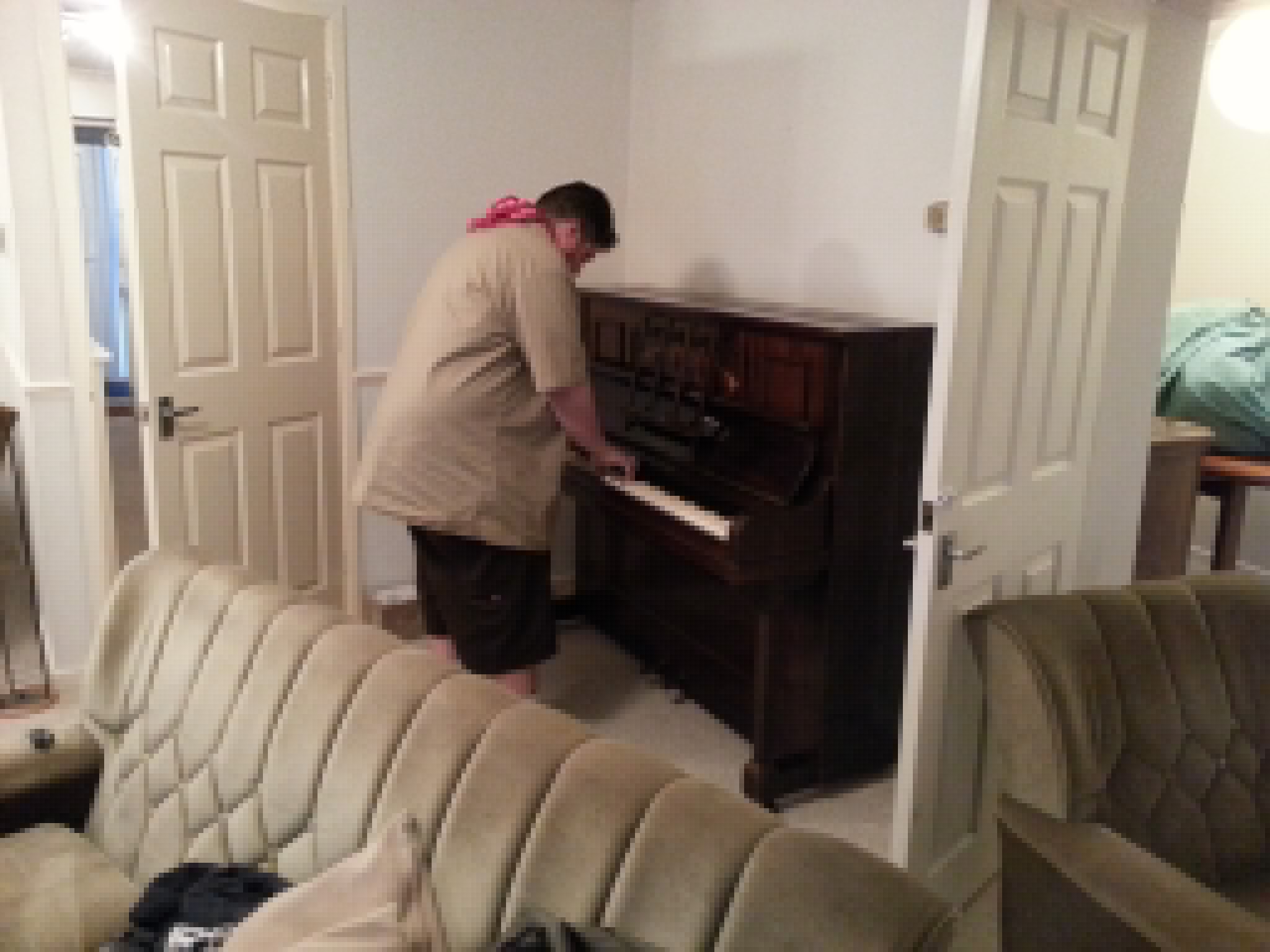 Full image of Alec tests the piano at Greendale.