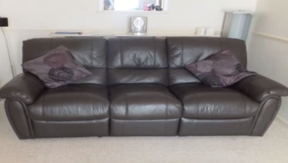 Full image of A faux leather couch.