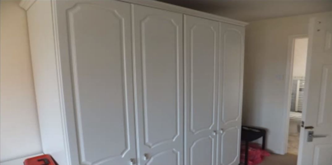 Full image of A pair of large wardrobes.