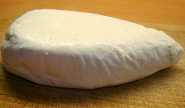 Full image of A block of cheese curd.