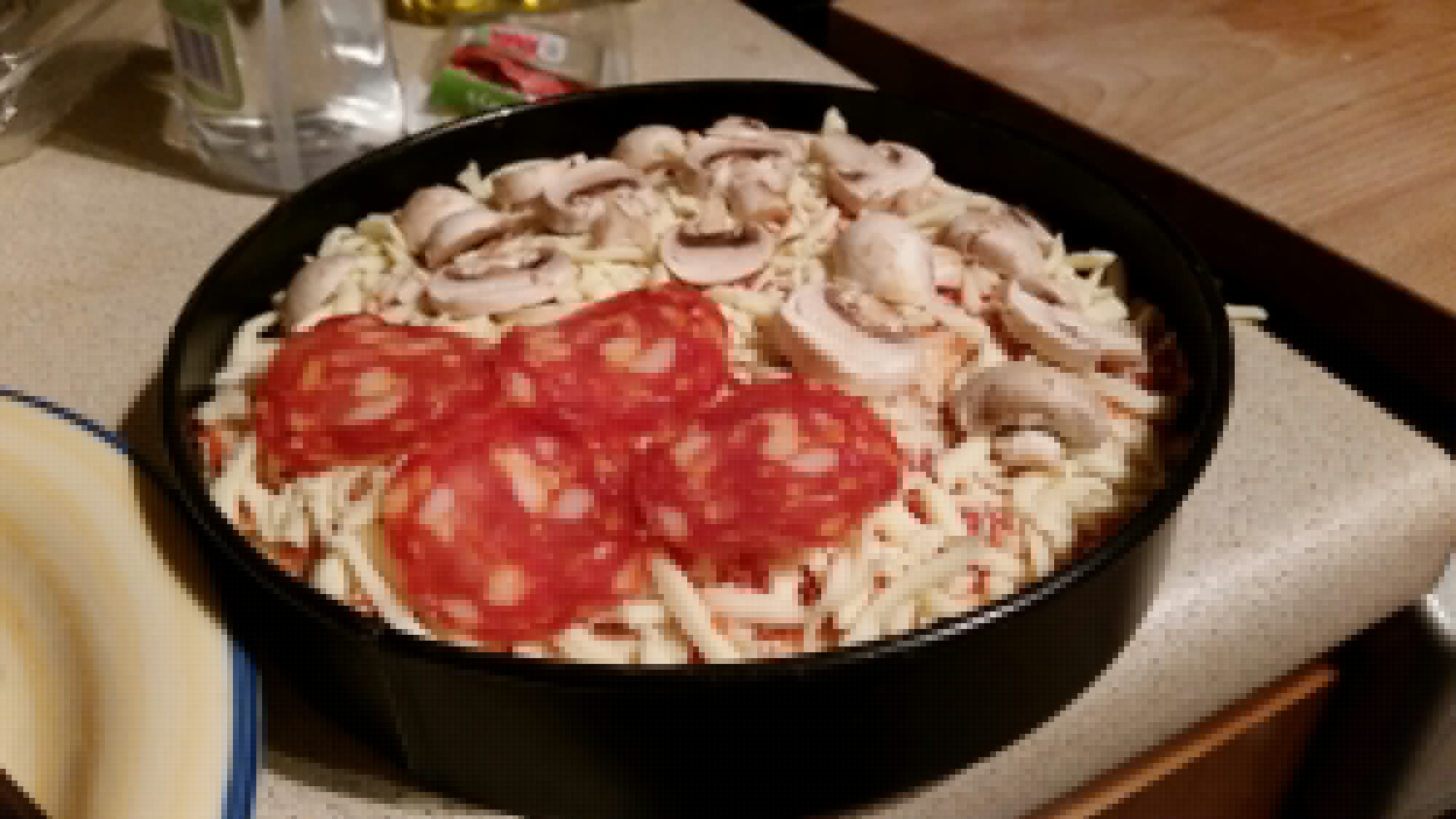Full image of Pizza cake ready to go into the oven.