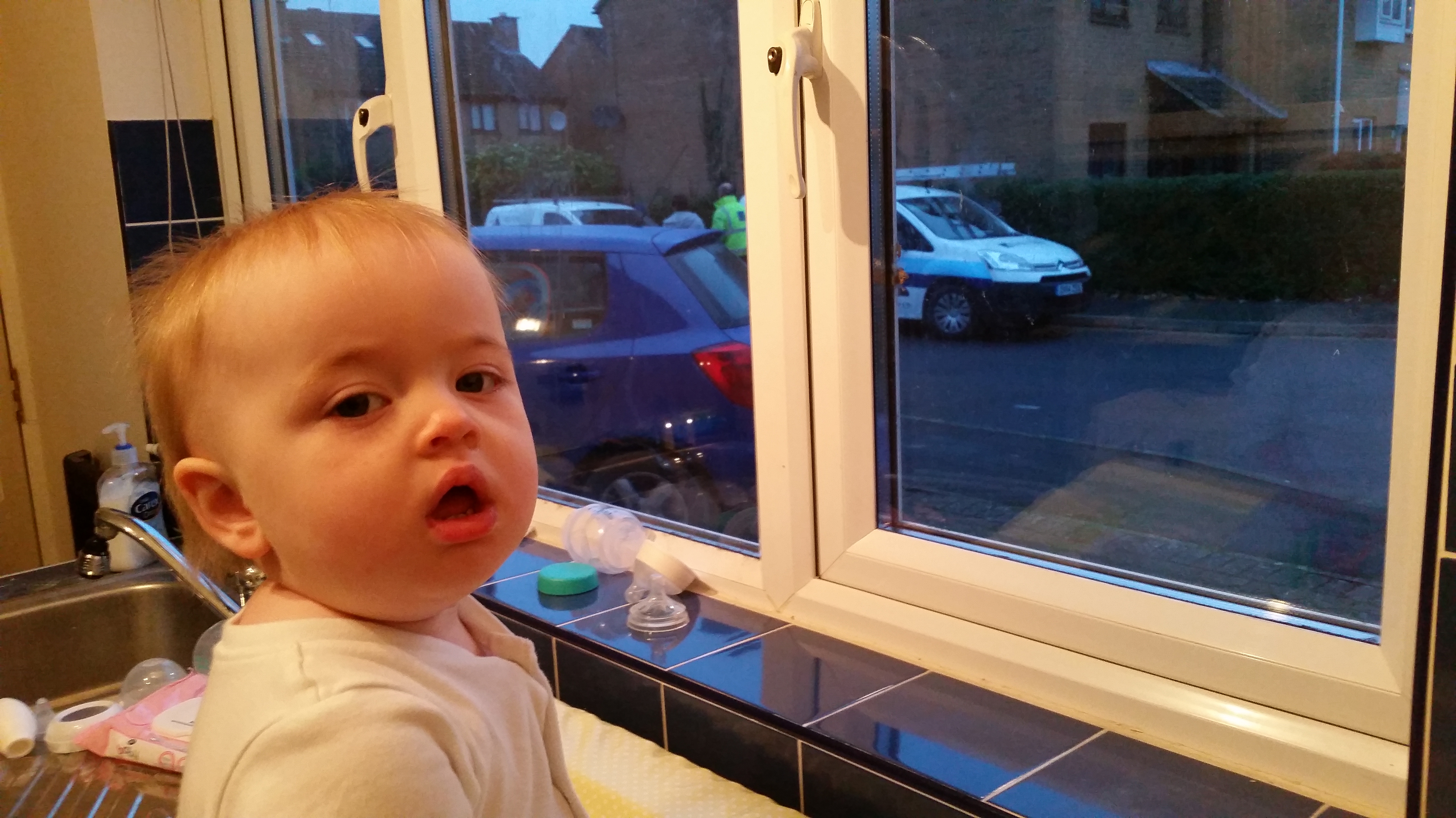 Full image of Annabel watches the solar panelling team arrive.