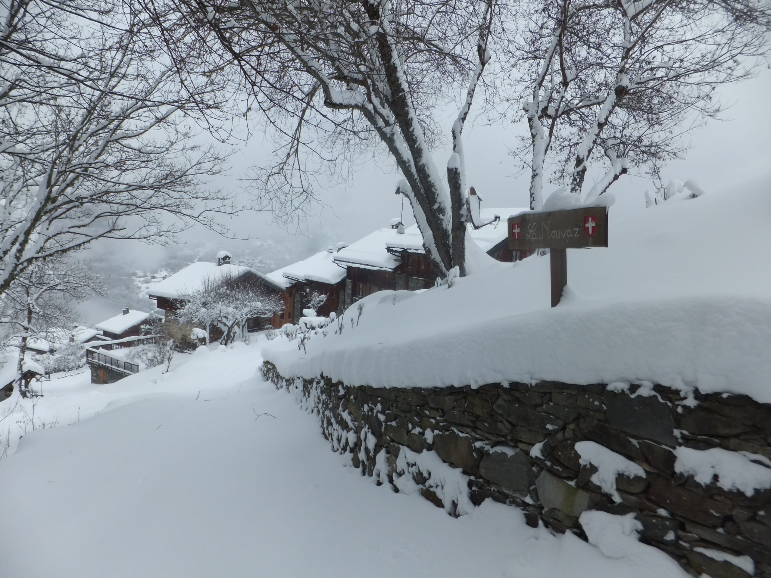 Full image of This photo should be titled "La Nouvaz Reservoir". Can you see the reservoir? No? It's under that pile of snow on the right!