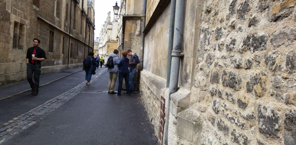 Suspected-geocachers in Brasenose Lane.