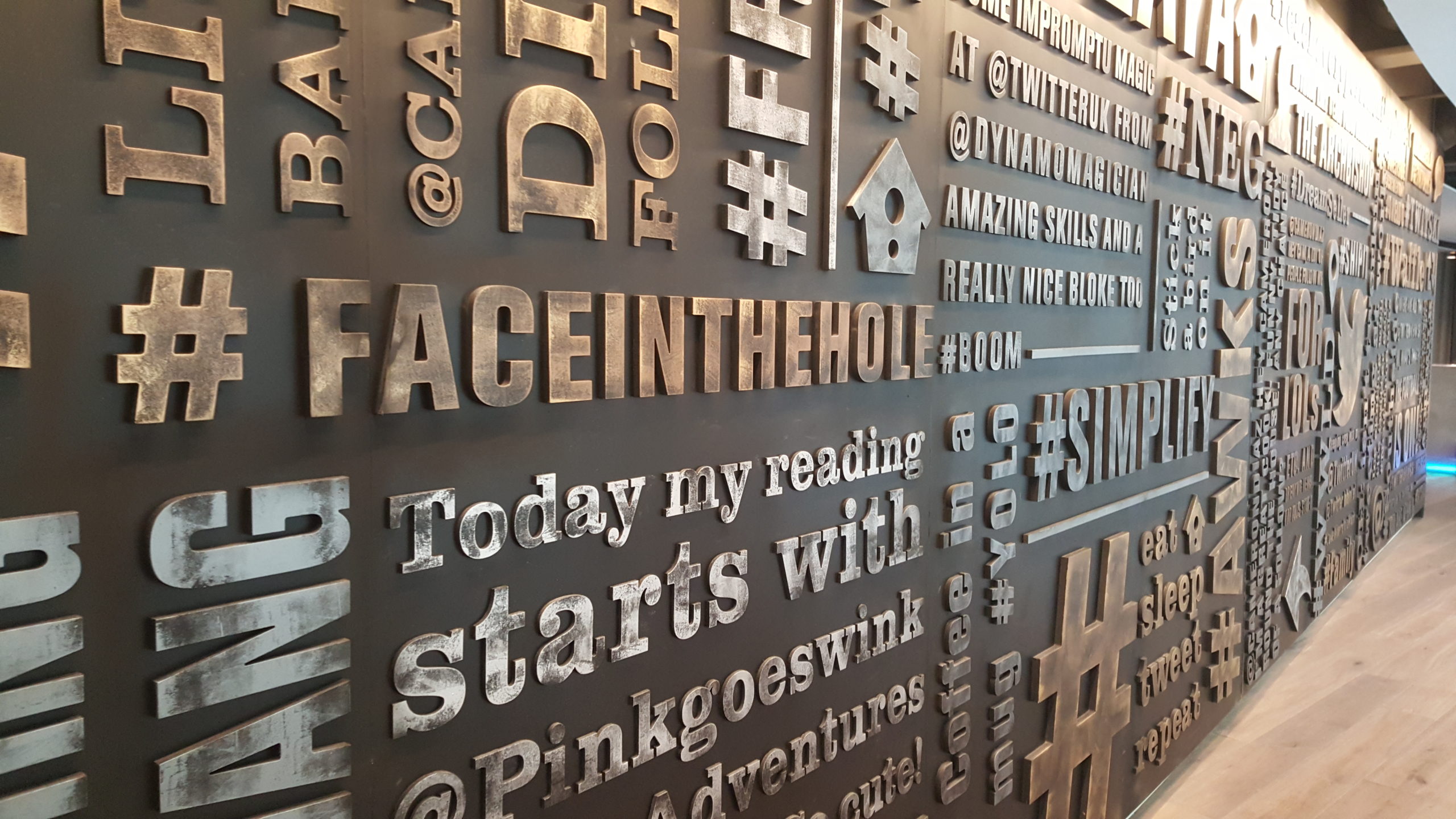 Full image of Twitter's reception with its "tweet wall" sculpture.