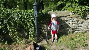Annabel by an old-style water pump.