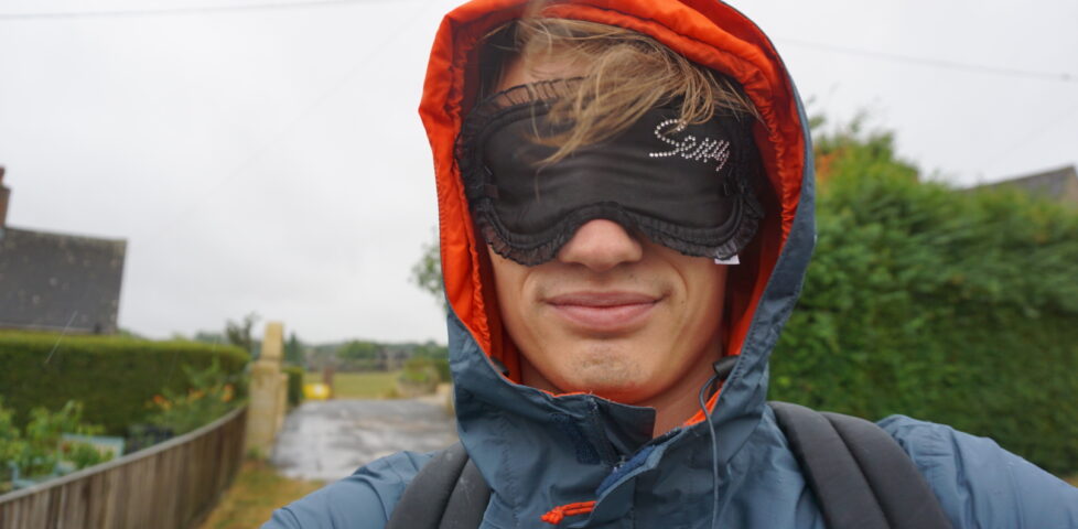 Robin wearing a "Sexy" blindfold.