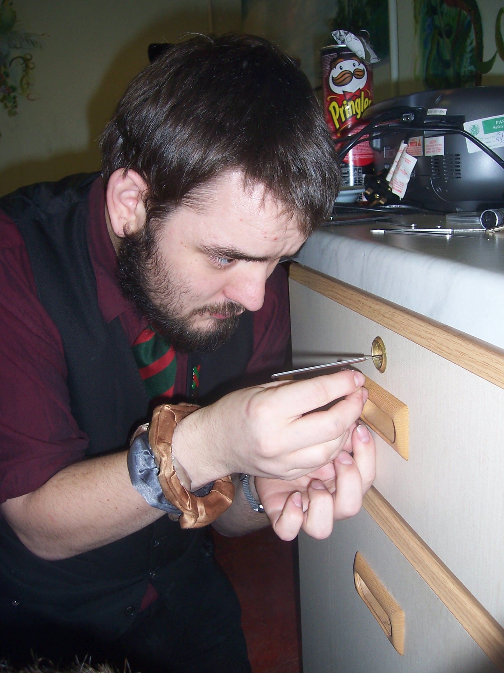 Full image of JTA learning to pick locks during a break at Nightline training
