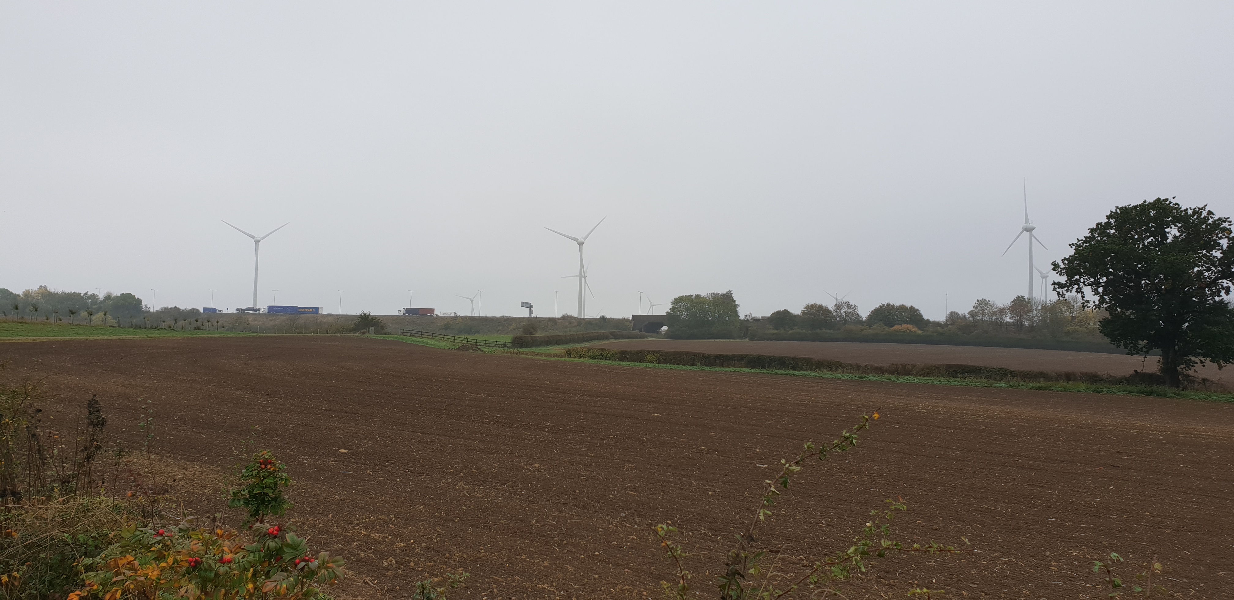 Full image of Windmills over a motorway