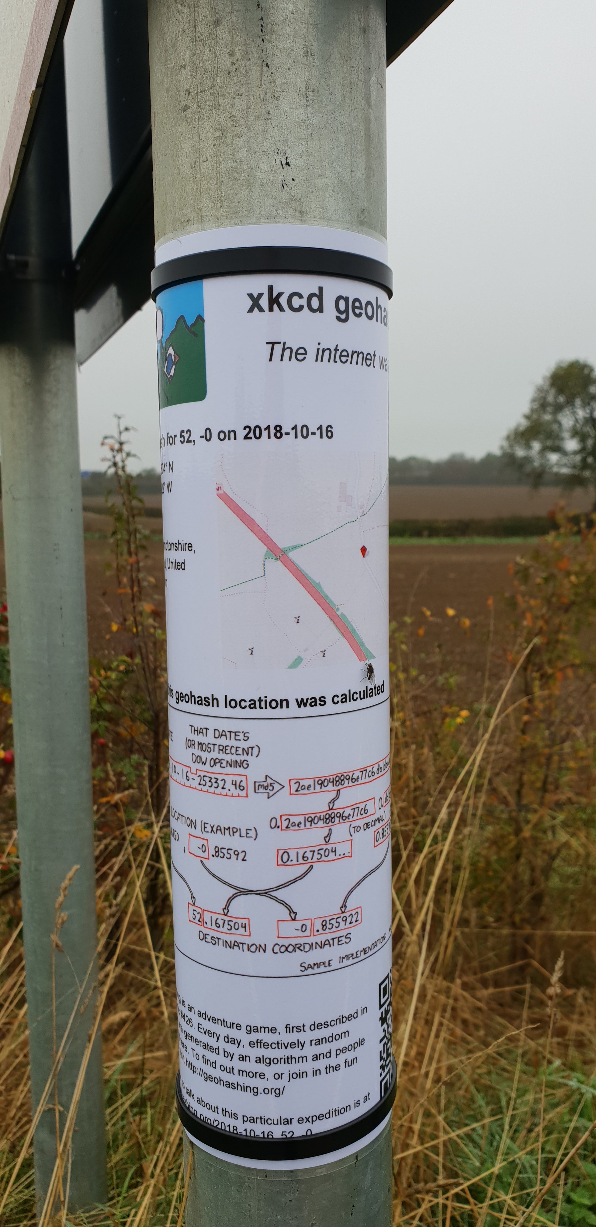 Full image of Geohashing sign attached to a convenient sign post.