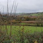 Nothing but farmland for miles around - the nearest settlement in the distance