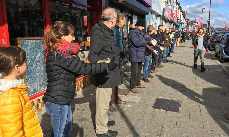 Human chain moving books