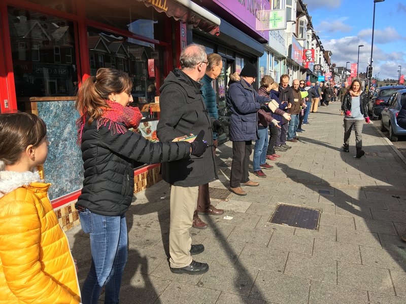 Human chain moving books