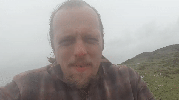 Dan struggles against the beginnings of a storm, near Penzance
