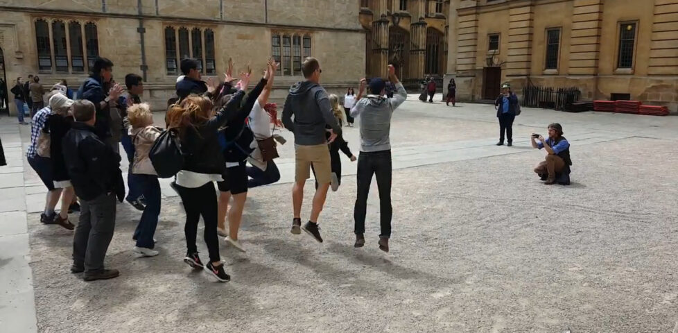 Image representing post: "Jump Man" from Footprints Tours Oxford making people jump around outside the Bodleian Library