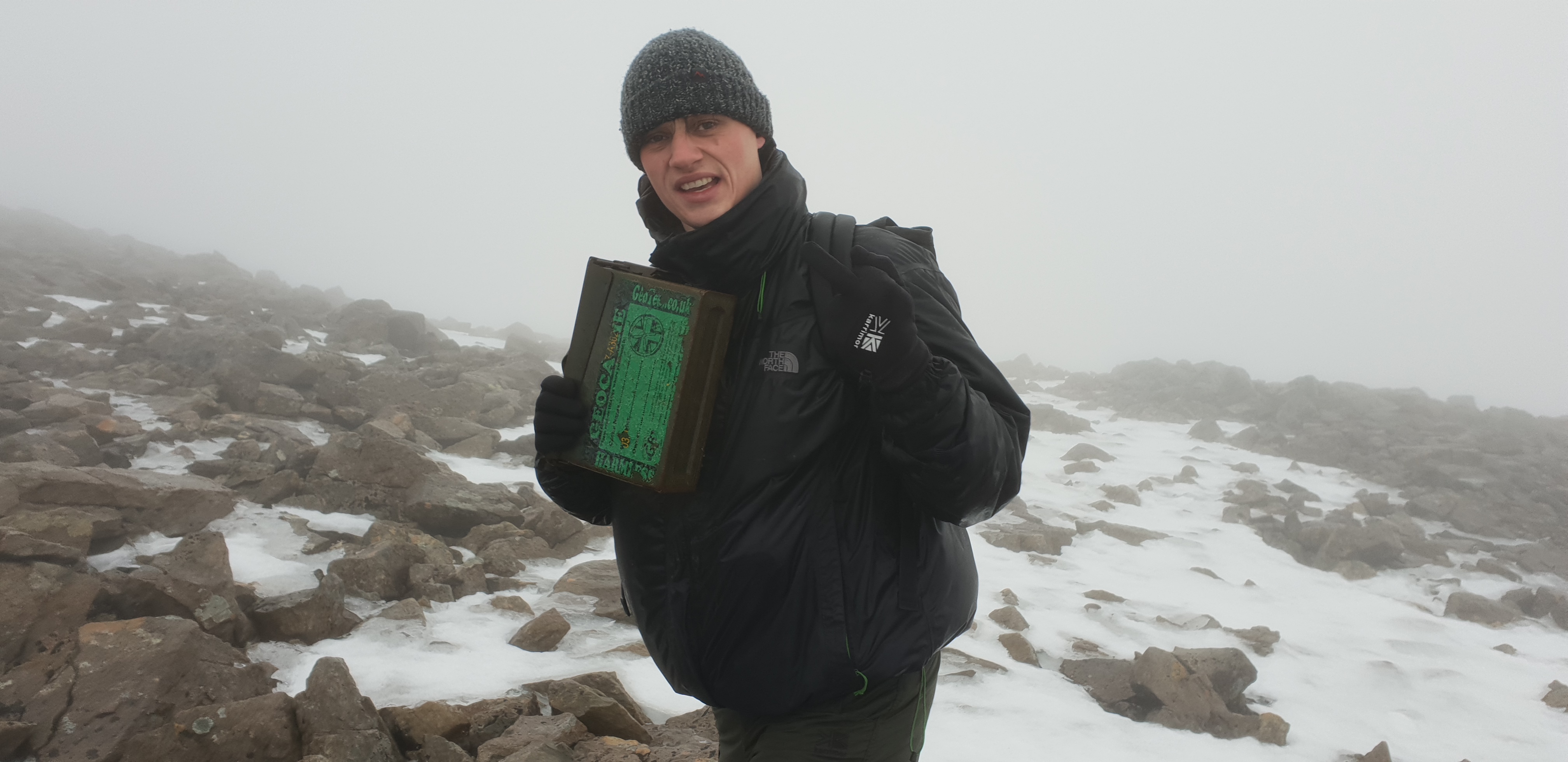 Full image of Robin with the GCG6XD, the Ben Nevis summit geocache