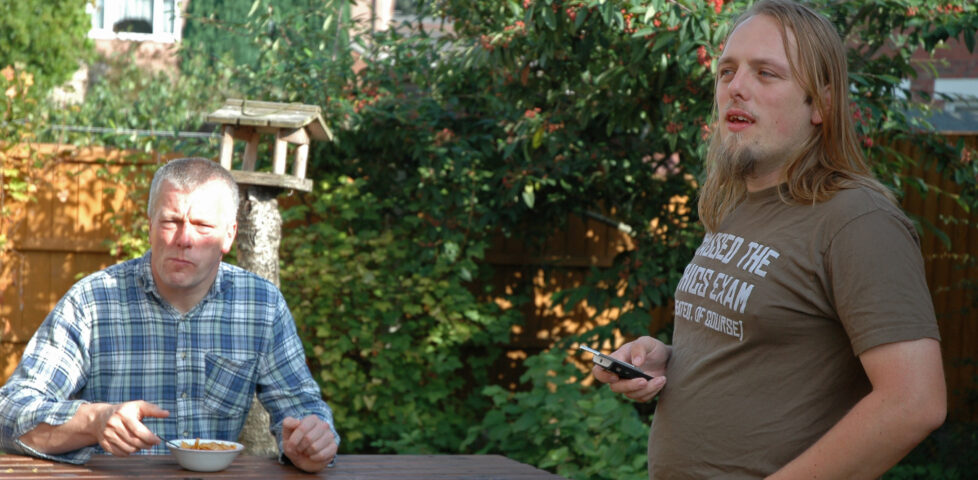 Dan and his dad have breakfast in the garden.