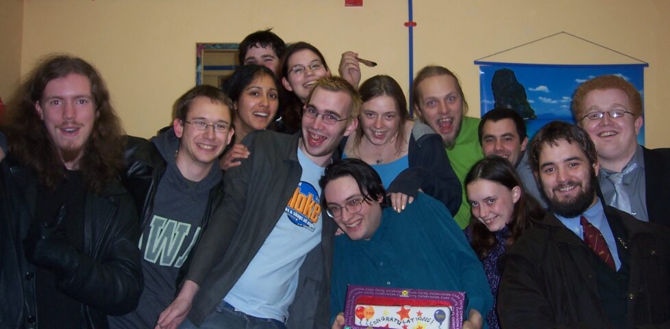 Paul and friends with cake in the lodge.