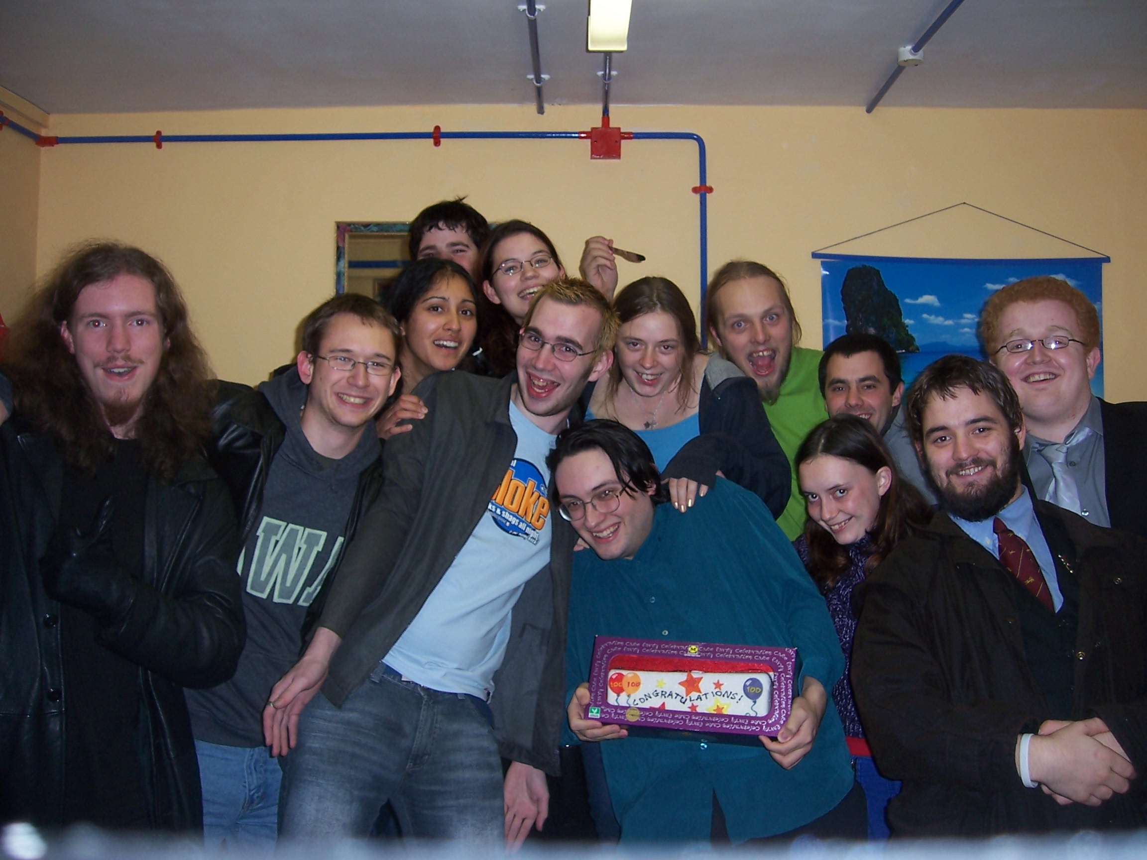 Paul and friends with cake in the lodge.