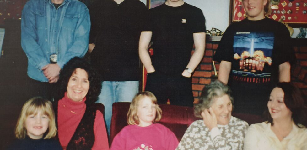 Dan with his Uncle Tom, Aunt Anne, cousins Thomas and Stephen, sisters, grandmother, and a woman who's probably the girlfriend of one of his cousins