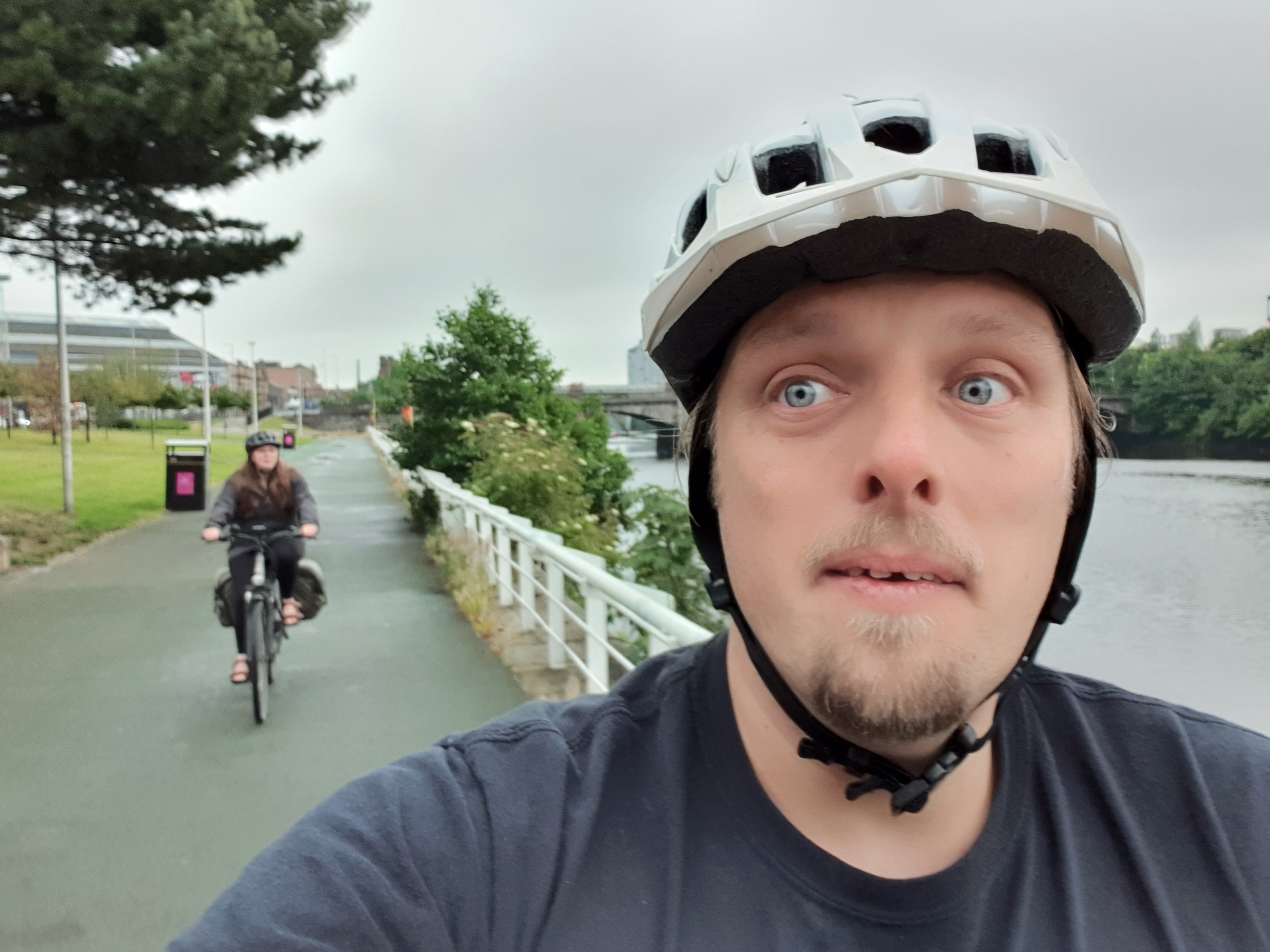 Full image of Dan and Ruth cycle alongside the Clyde.
