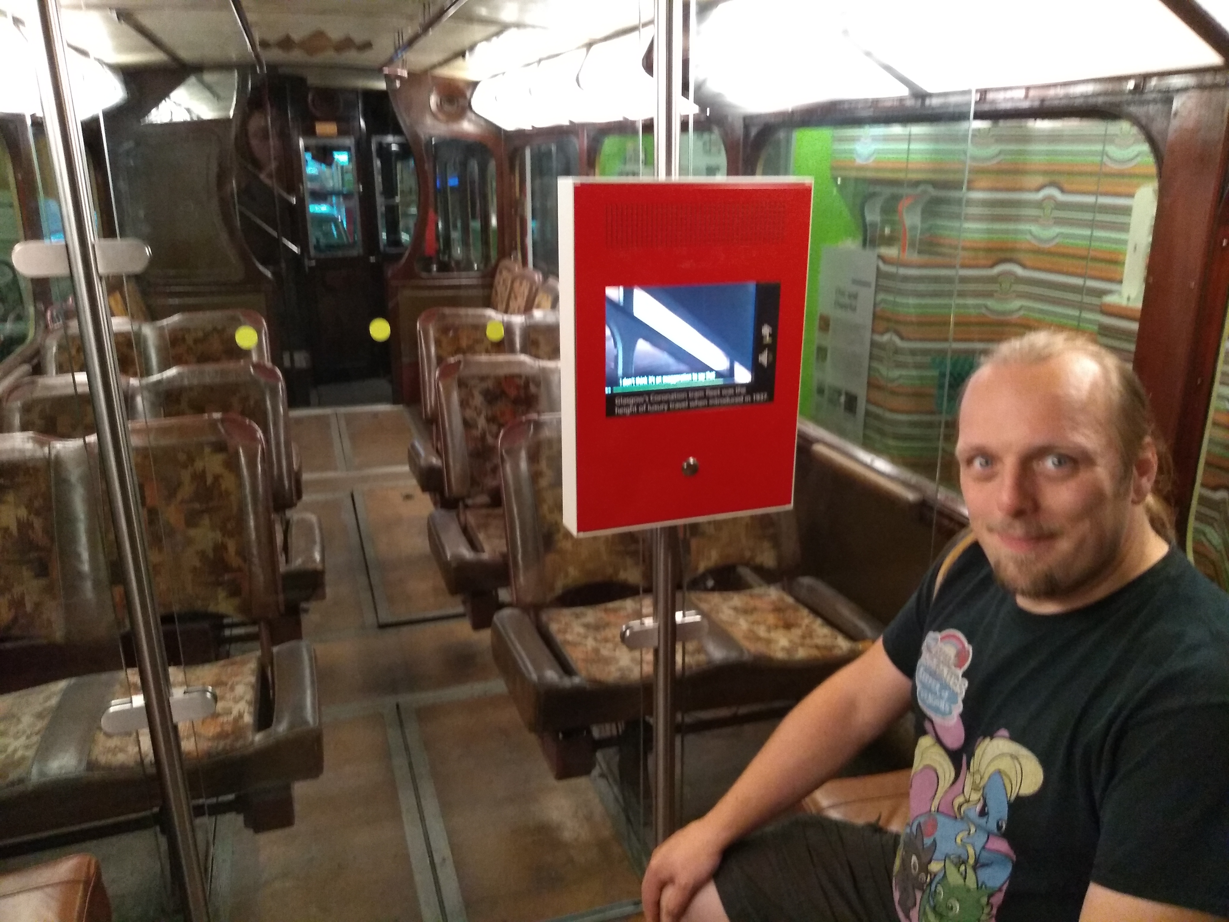 Full image of Dan aboard a restored "Coronation" tram