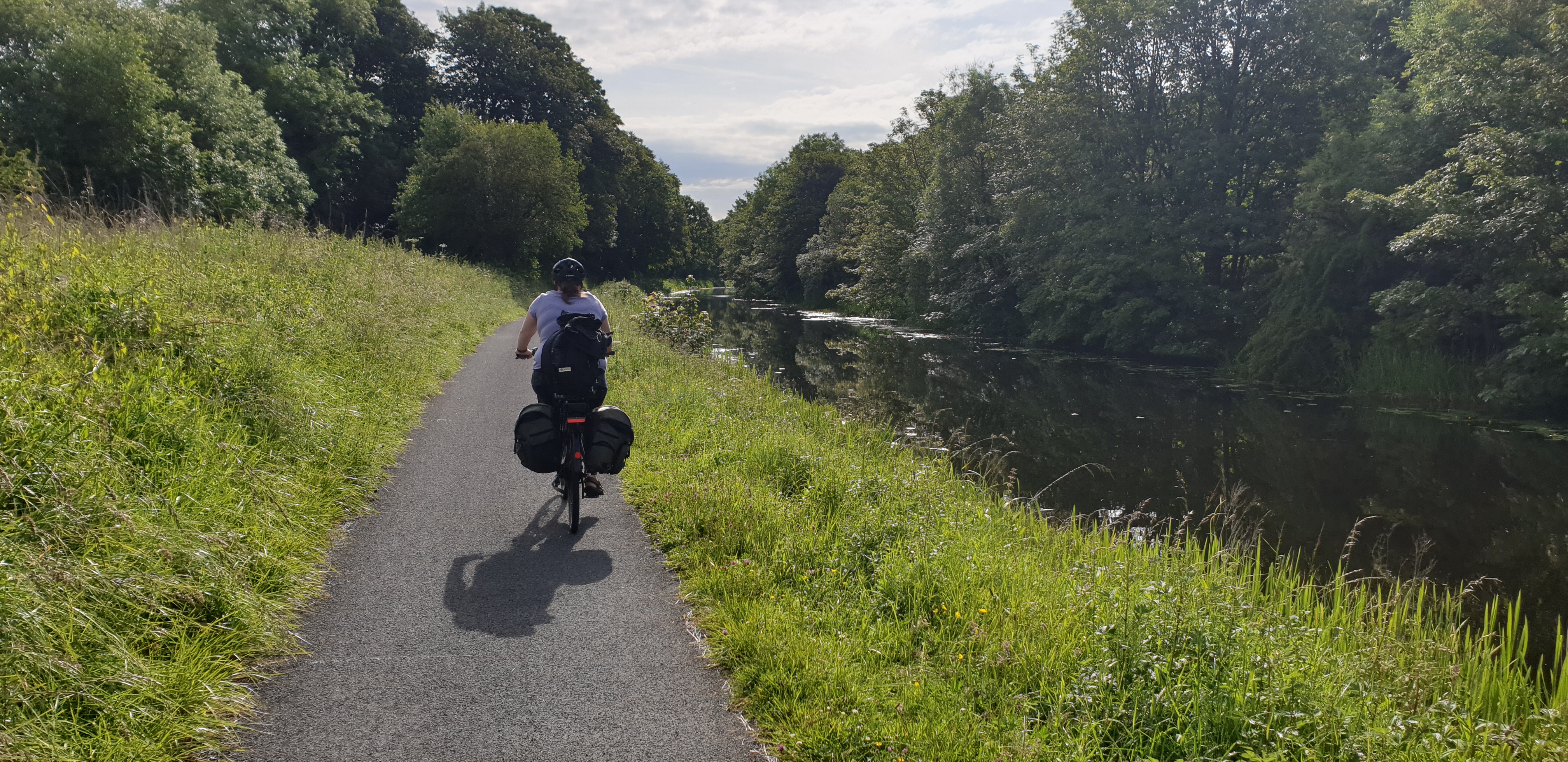 Full image of Ruth rides alongside the Forth & Clyde canal.