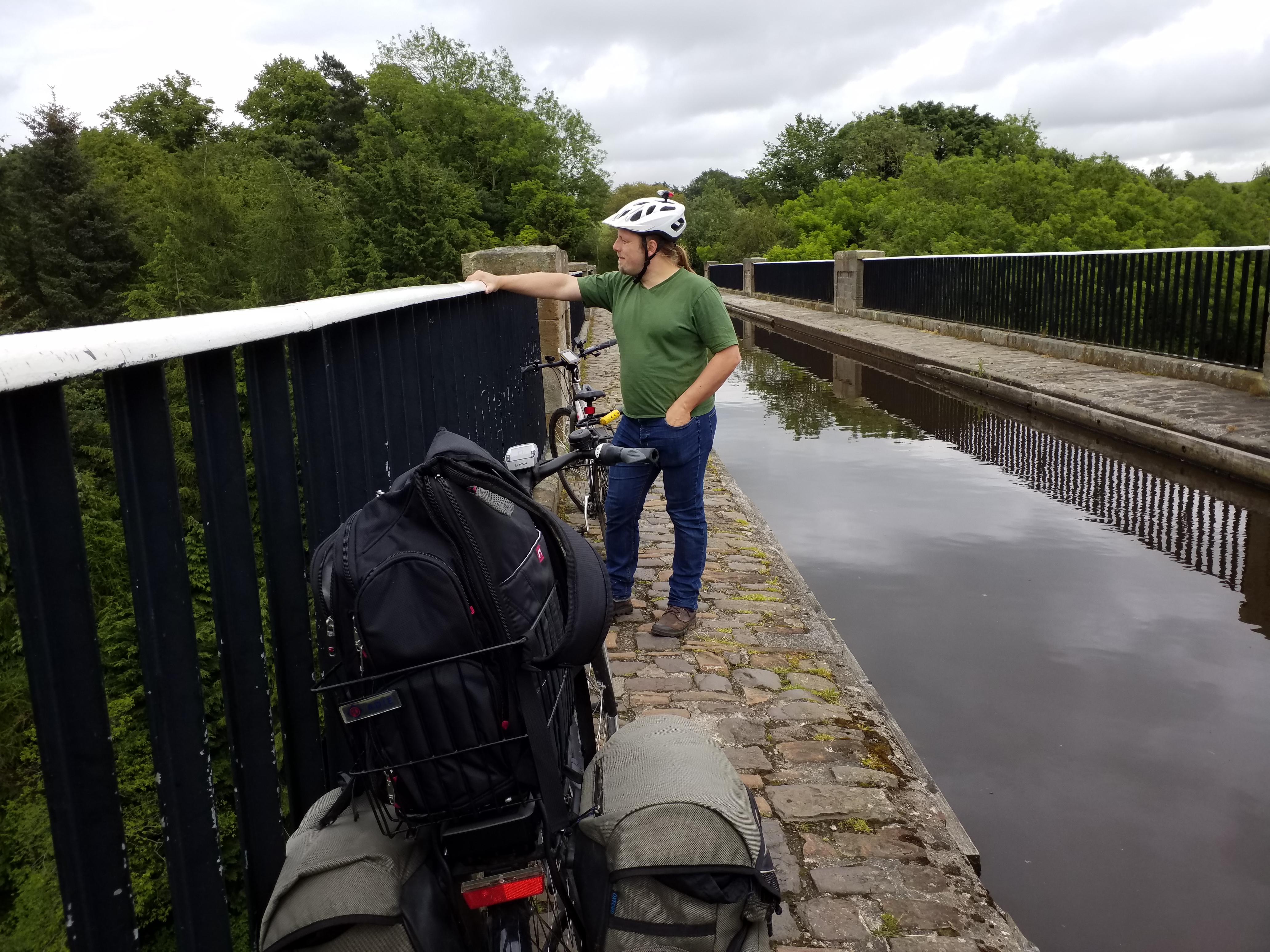Full image of Dan looks over the edge of the Almond Aqueduct