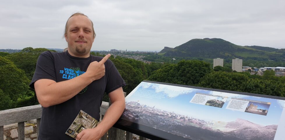 Dan points to Edinburgh Castle in the distance