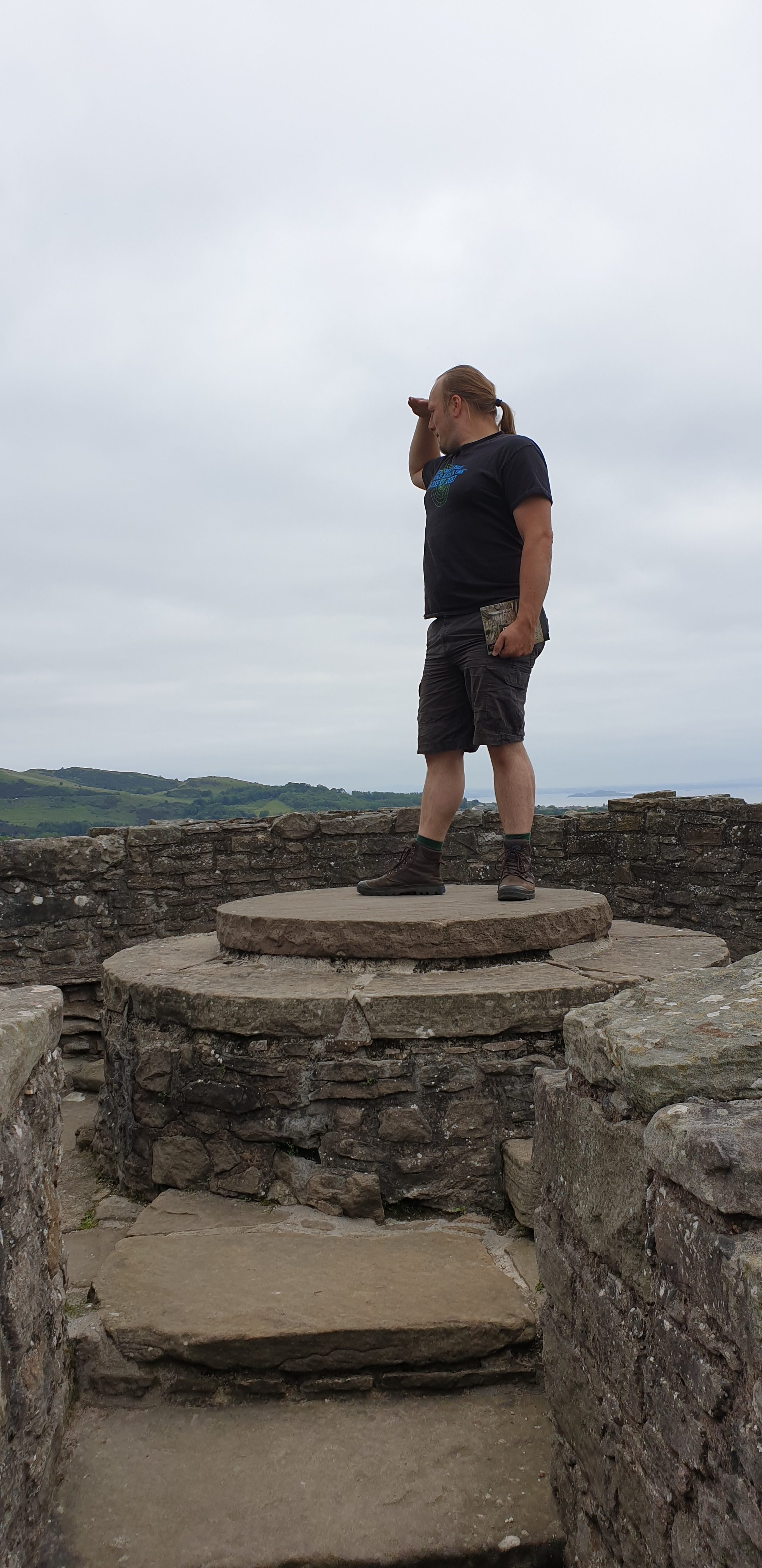 Full image of Dan atop a plinth in Craigmillar Castle