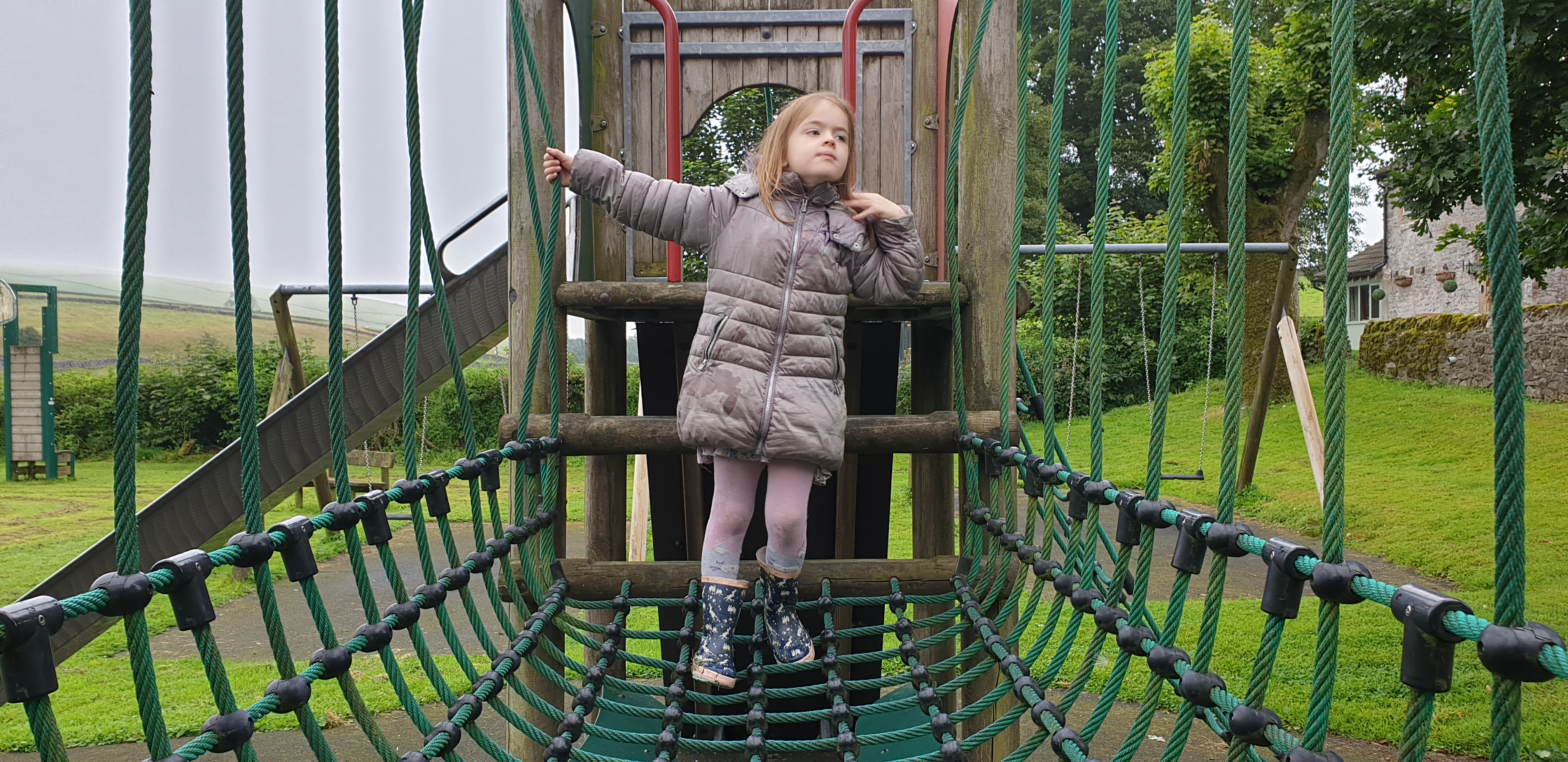 Full image of Annabel on the climbing frame.