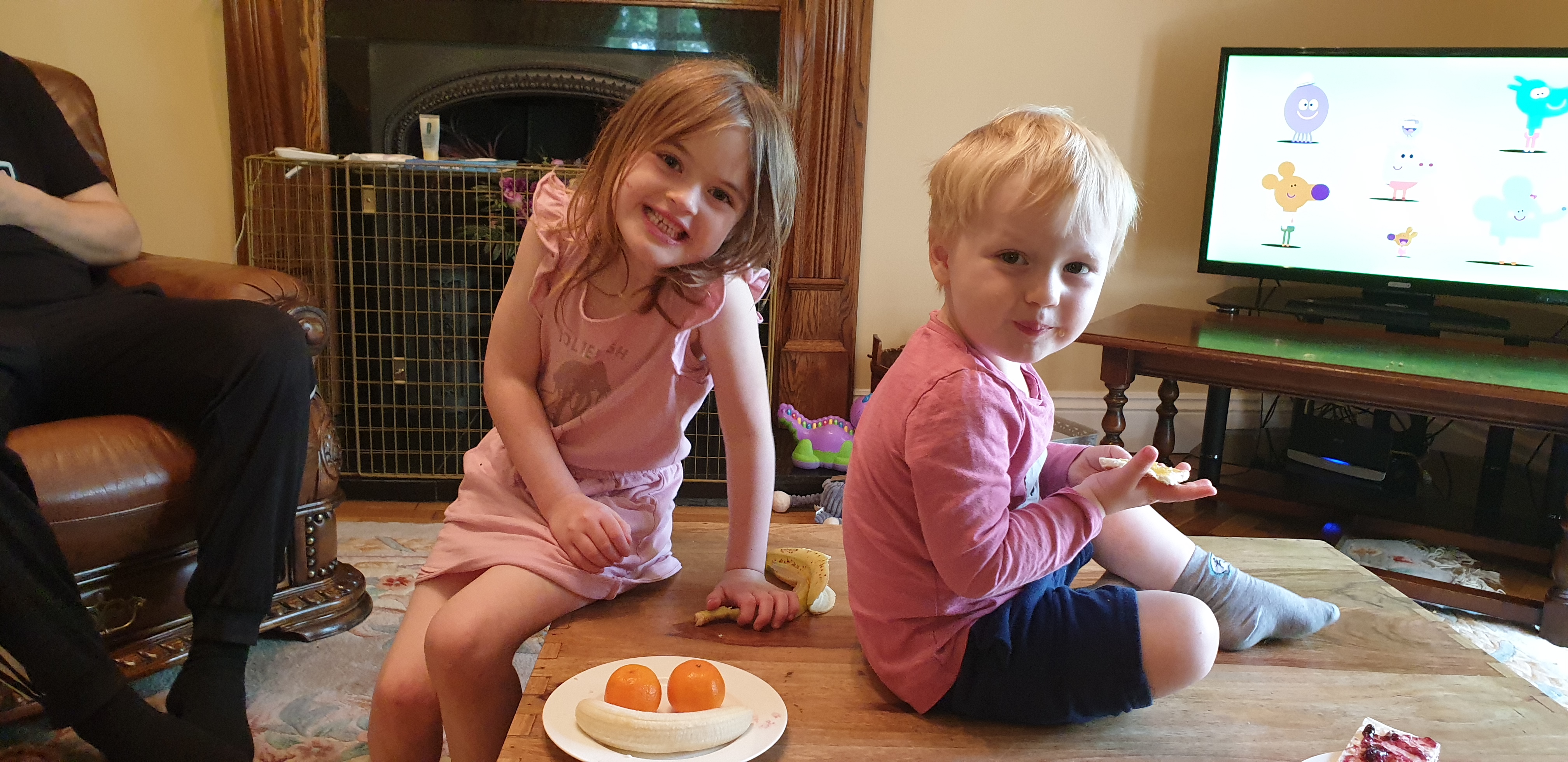 Full image of Annabel and John decorate with fruit.