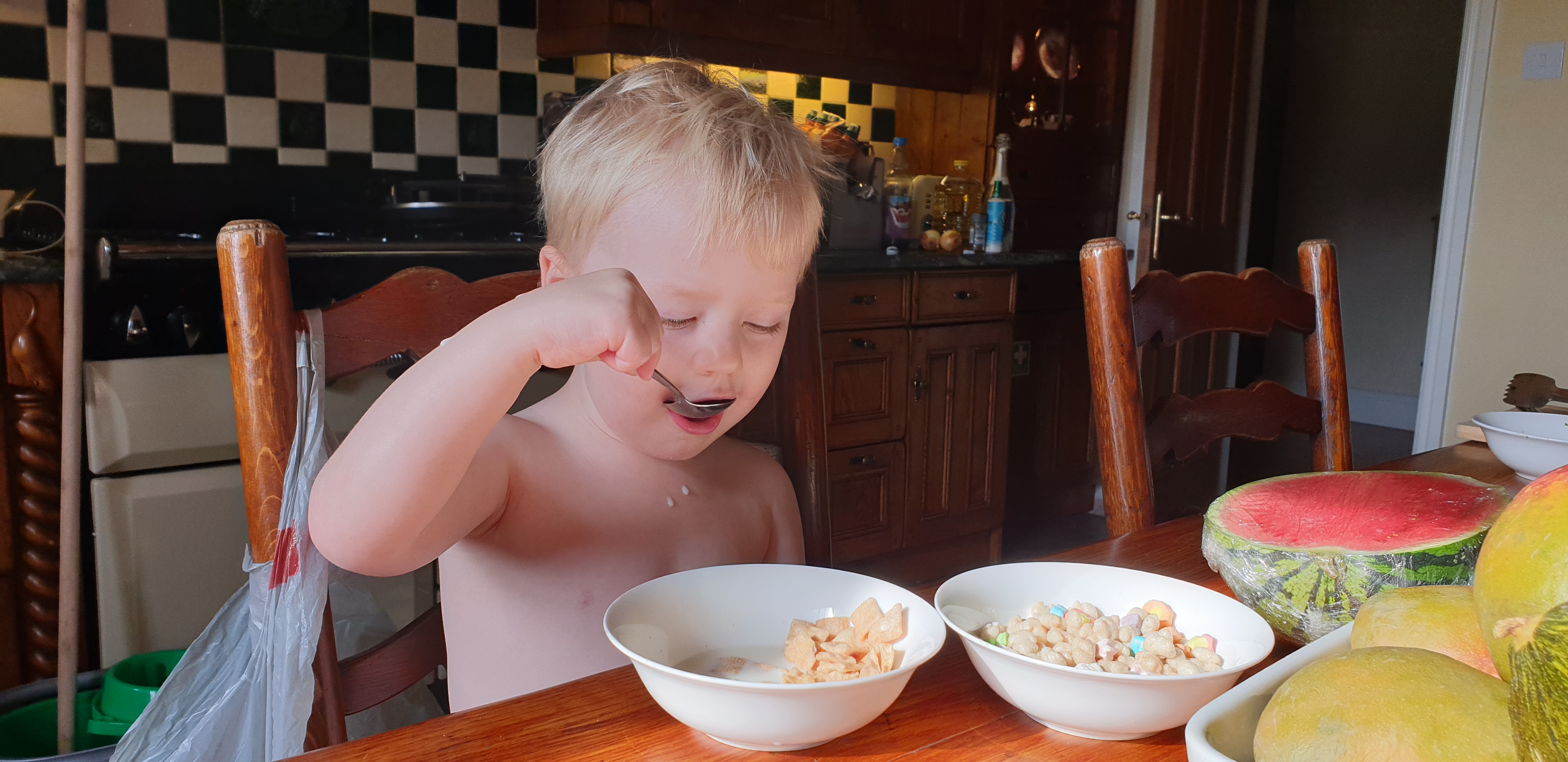 Full image of John with double bowls of breakfast on Tuesday morning.