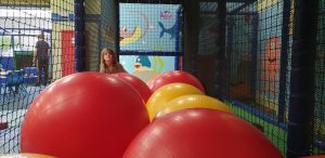Annabel peers over the mega balls.
