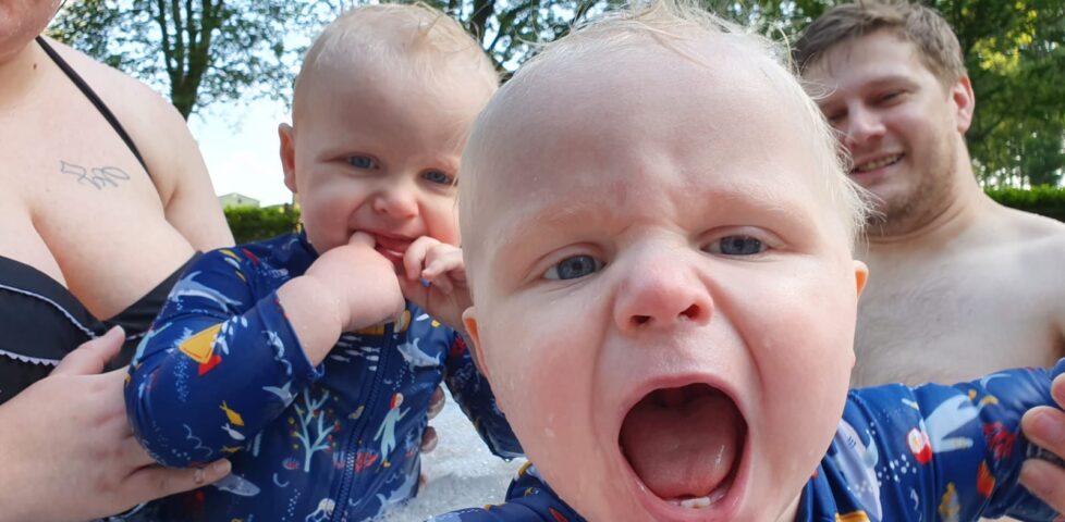 The twins, excited, in the hot tub.