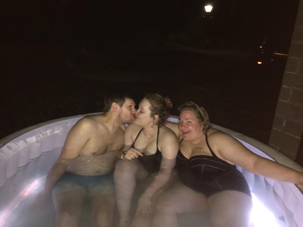 Full image of Graham kisses Jemma alongside Becky in the hot tub.