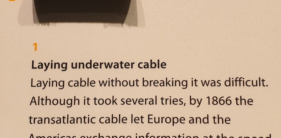 Exhibit of early transatlantic telegraph cable with message implying that it enabled "speed of light" communications.