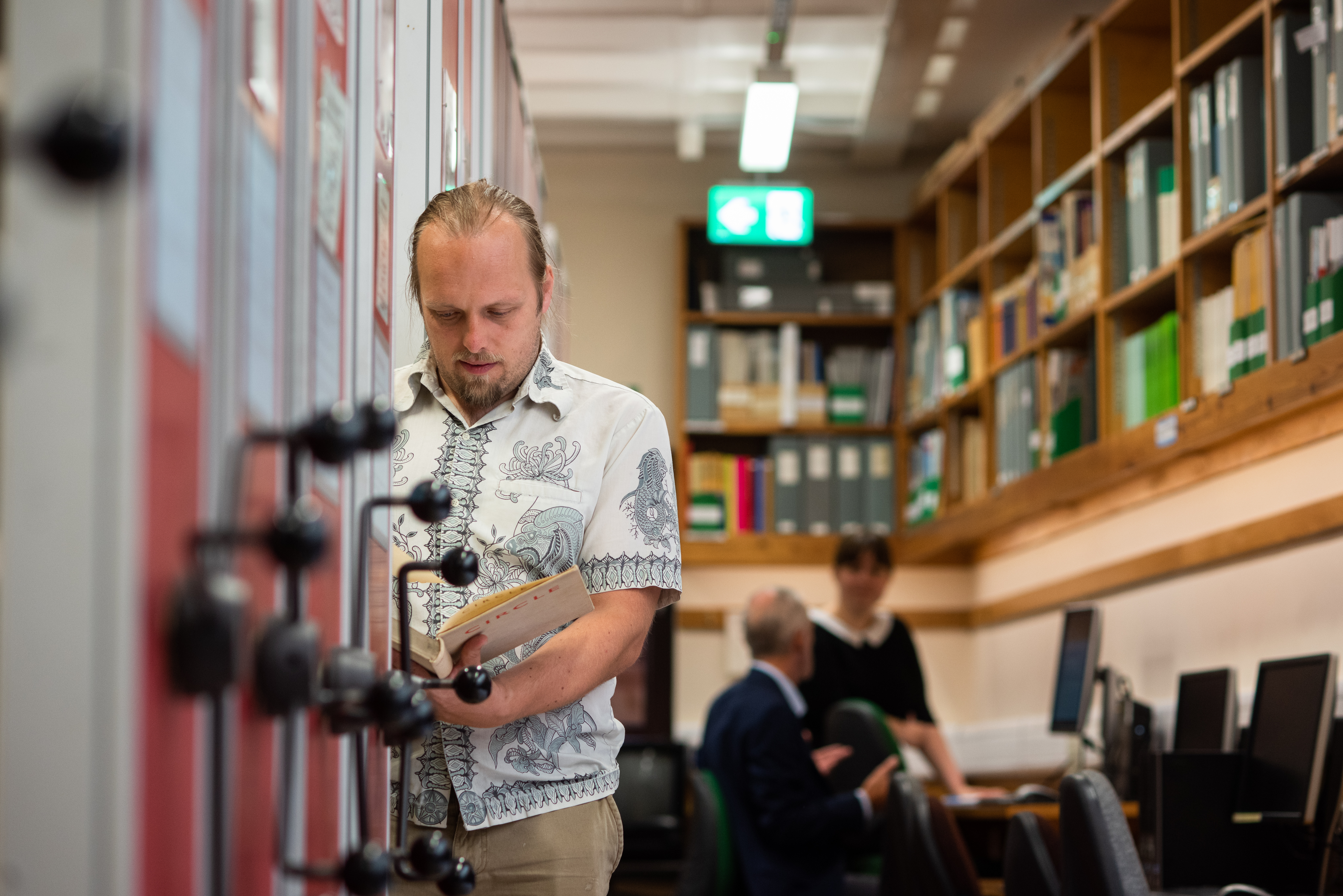 Full image of Dan in the rolling stacks.