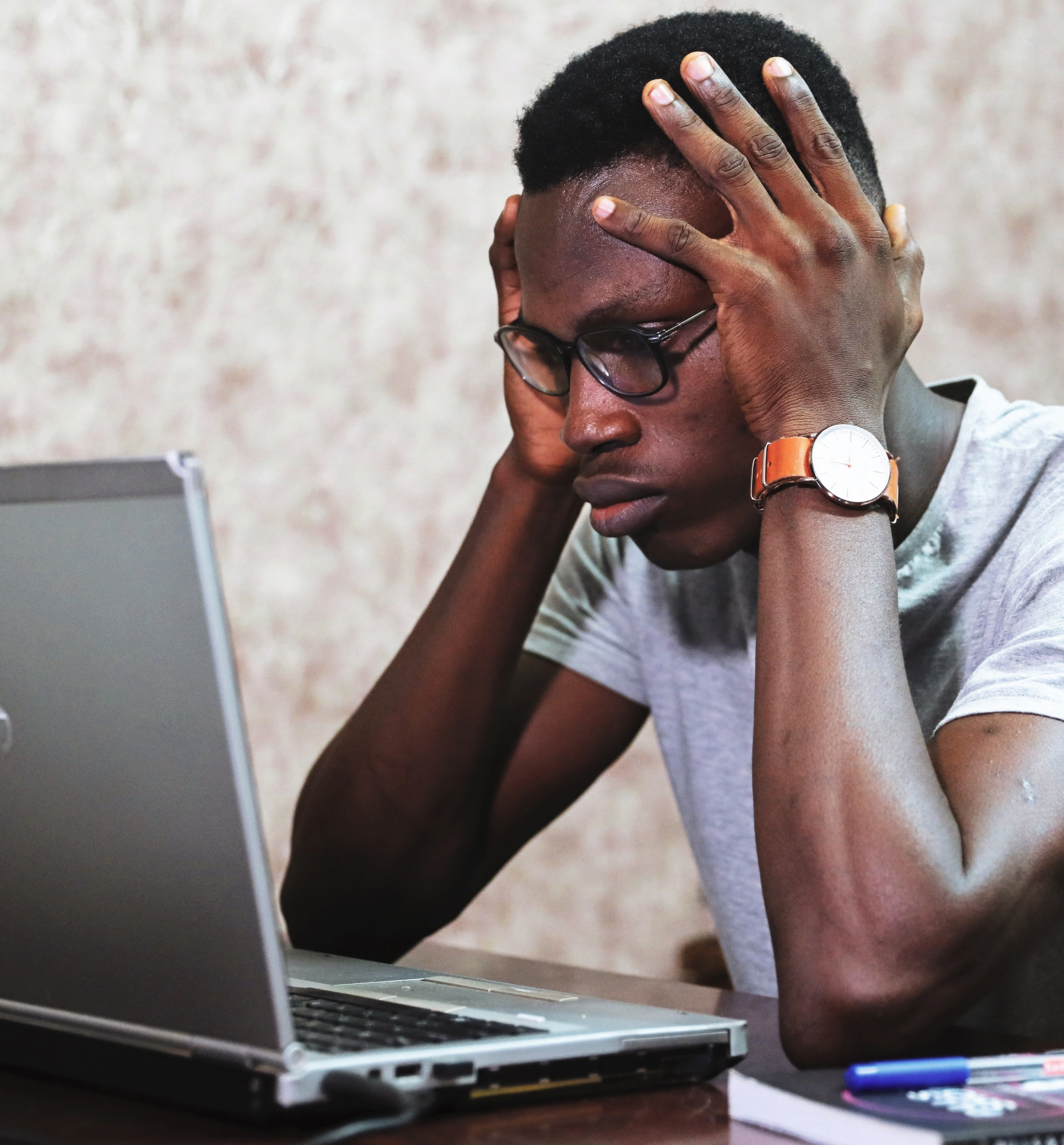 Full image of Man staring intently at laptop. Image courtesy Oladimeji Ajegbile, via Pexels.