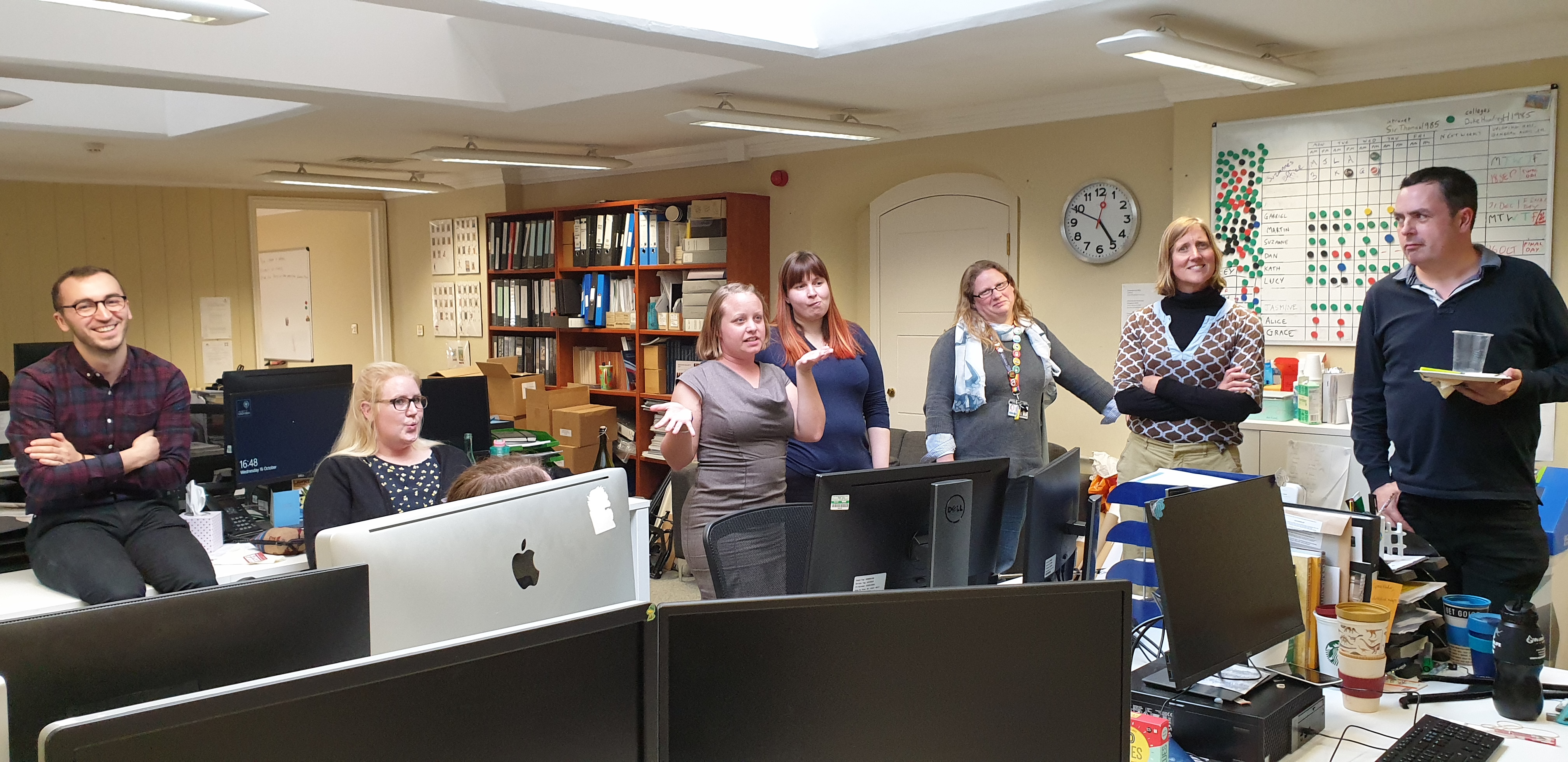 Full image of Coworkers competing agressively for tiny prizes.