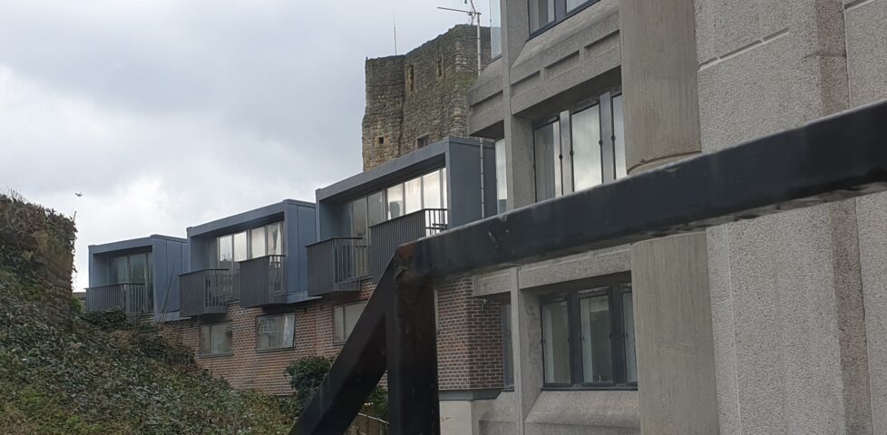 View of 1960s buildings in front of Oxford Castle.