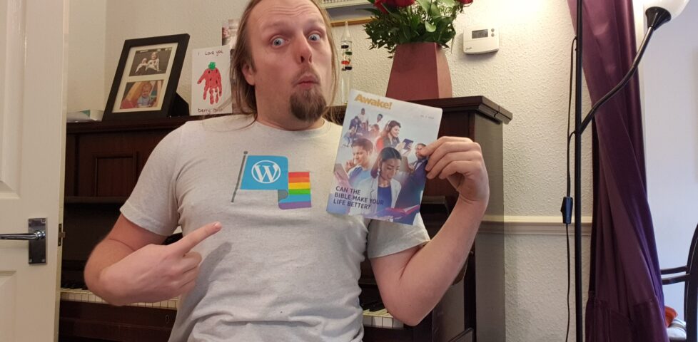 Dan with a copy of Awake!, wearing his WordPress Diversity t-shirt.