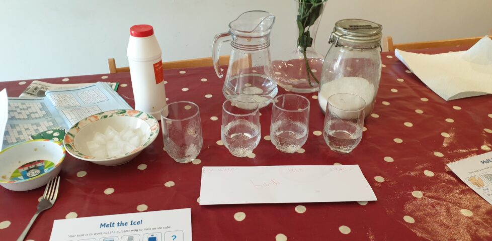 Bowl of ice, glasses of water, salt and sugar supplies.