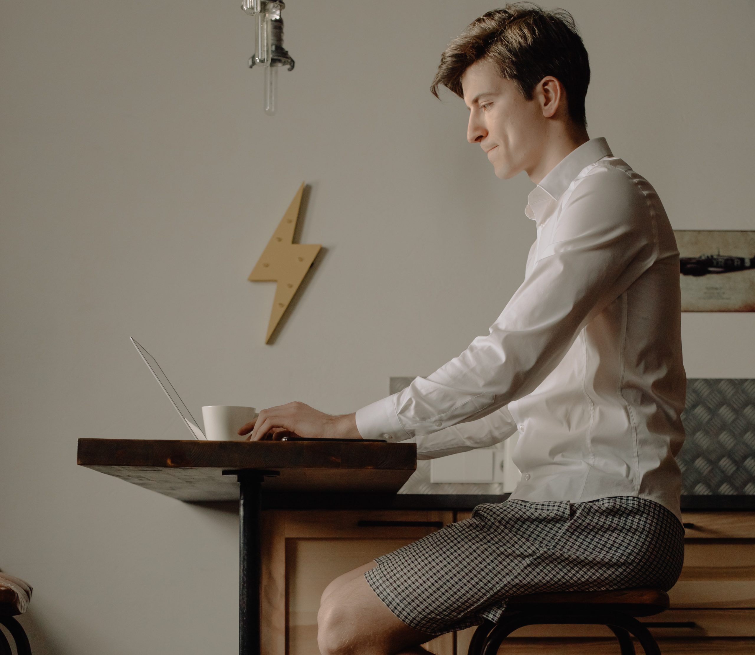Full image of Teleworker dressed from the waist up.