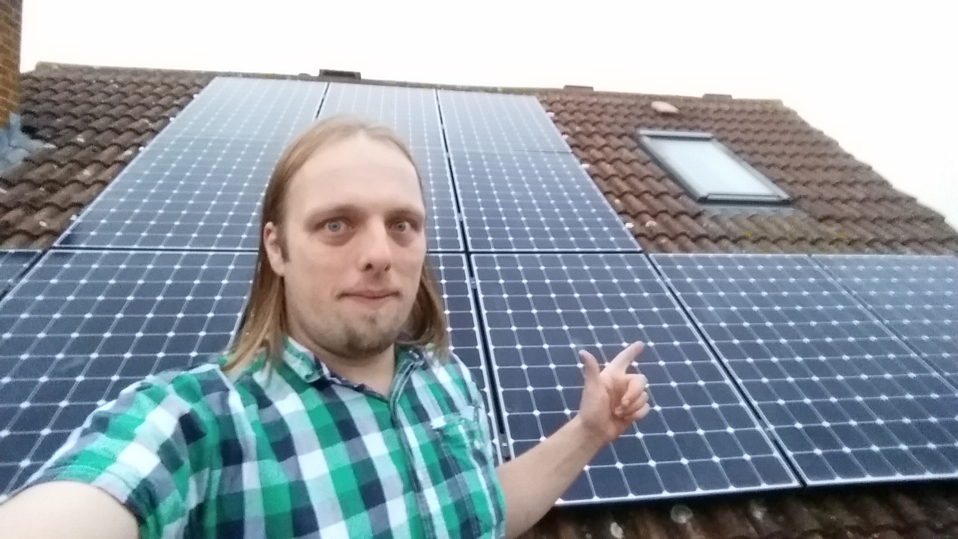 Full image of Dan with his solar panels.