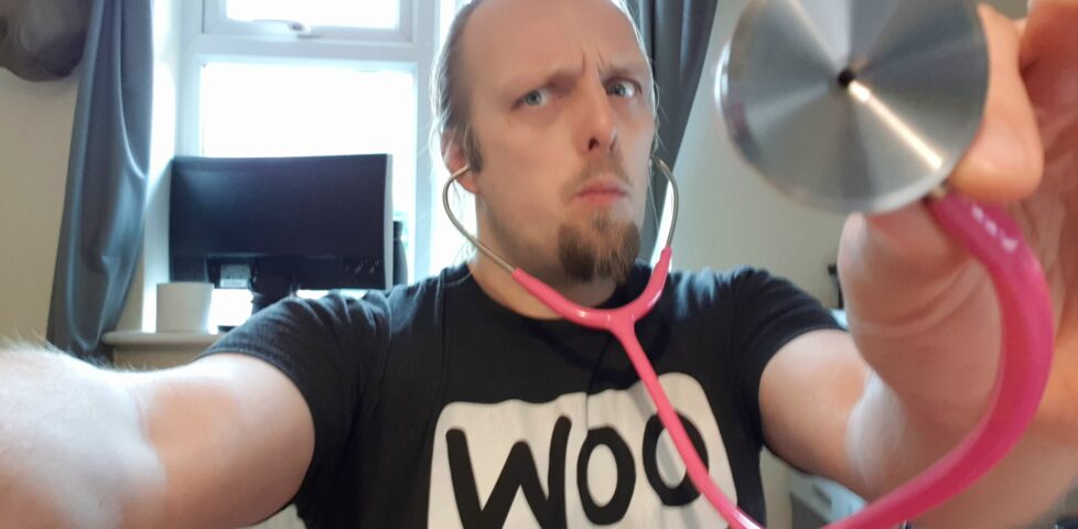 Dan with a pink stethoscope