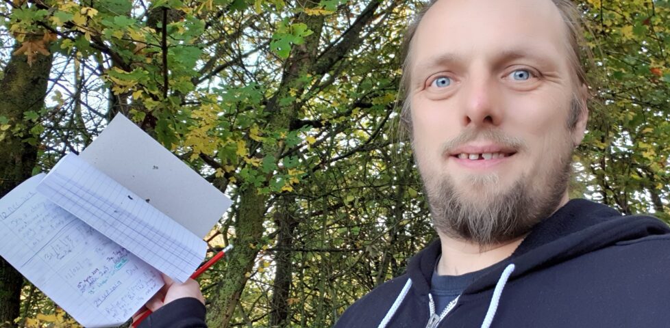 Dan with Wild Wolf Three's logbook